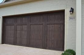 Black And White House With Wood Garage Door Pin By Village Homes Of Fort Worth T On Village Homes Exteriors Garage Doors Exterior Brick Garage Door Design