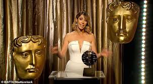 Alex Jones exudes glamour in a plunging white dress