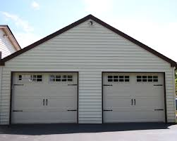 Made in sections, and then transported to the your site for construction and installation. Stamped Carriage House Sunrise Door Woodworks