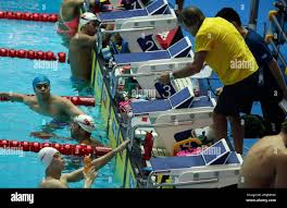 China's Sun Yang, left, listens to his coach Dennis Cottrell, right, during  a training session ahead of swimming competitions at the World Swimming  Championships in Gwangju, South Korea, Tuesday, July 16, 2019. (