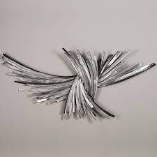 The crosshatched looping and silver and black finish of this metal wall decor brings abstract art motion to your walls. Infinity Silver Metal Wall Sculpture Silver Wall Art Metal Wall Sculpture Metal Wall Art Decor
