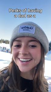 Ski and Snowboarder Going Down Slope