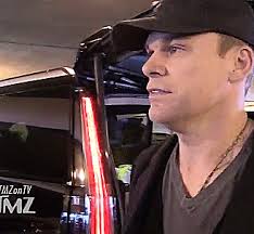 A fan, getting the extra treatment.... Michael C. Hall backstage at a “Lamb  Of God” concert.