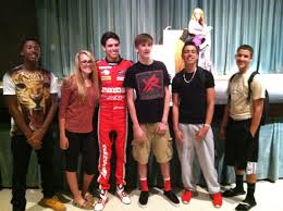 Olympics logos must be kept clean and easy to remember; Professional Race Car Driver Tristan Nunez With Olympic Heights High School Students Race Cars High School Olympics