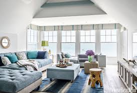 Family Room Furniture The Sectional Is Upholstered In Manual Canovas Fabric And The Cu Beach House Living Room Beach Living Room Beach House Interior Design