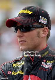 The crew of Scott Wimmer, driver of the Caterpillar Dodge, pushes the...  News Photo