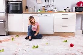 Often comprised with a sink and a lot of clutter. Unhappy Young Woman Sitting On Dirty Kitchen Floor At Home Stock Photo Picture And Royalty Free Image Image 93506817