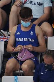 Tom daley is a doting father to son robbie, who he welcomed via surrogate in 2018 with his husband dustin lance black. Tom Daley Seen Knitting In Stands At Tokyo Olympics Photos Popsugar Fitness