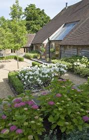 Contemporary Country Courtyard Garden Design For A Barn Conversion In West Sussex Box Roses A Courtyard Gardens Design Country Garden Design Courtyard Garden