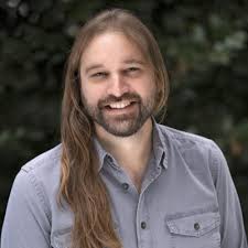 Large clusters of cherry tomatoes growing in the raft aquaponics system at  Myers Park High School in Charlotte, NC.