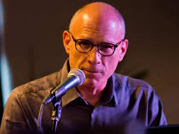 Acoustic Café founder Rob Reinhart 'adds another dimension' to national  radio show with Grand Rapids folk series