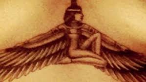 The large design spread right below her chest is a tattoo of the wingspan of the egyptian goddess, isis. Rihanna S New Grandma Tattoo