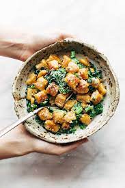 Sweet Potato Gnocchi With Broccoli Rabe And Garlic Sage Butter Sauce Pinch Of Yum Recipe Sweet Potato Gnocchi Sage Butter Sauce Recipes