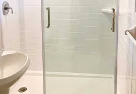 Compact elegant white tiled bathtub and shower combo. Shower Enclosures In Minneapolis By Great Lakes Home Renovations