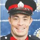 CITY MOURNS SLAIN OFFICER