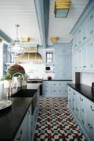 When viewed with the granite slabs of countertop the cabinets bring out the golden accents in the stone. The Interior Of This Historic Home Will Surprise You Kitchen Design Home Kitchens Painted Kitchen Cabinets Colors