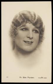 Billie Manders in drag; vignette portrait. Photographic postcard, 1929.