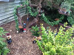 Gnomes In The Trees Bushes And Driving Car Gnome Garden In The Tree Garden