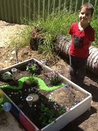 Pin By Carrie Davis On My Stuff Dinosaur Garden Diy Garden Projects Fairy Garden