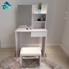 A contemporary and modern bedroom vanity table that features a solid construction with simple lines and white finish that is neutral, so it looks very nice in any bedroom decor. Modern Simple Design Cheap Price White Dressing Table With Mirror China White Dressing Table Dressing Table With Mirror Made In China Com