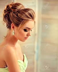 Get inspired by this hairdo and take your hair game up a notch. Beautiful Woman Dressed In Evening Gown Example Of Wedding Hairstyle Stock Photo Picture And Royalty Free Image Image 85037412