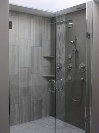 In our modern farmhouse kid's bathroom, we're planning on a whole wall of subway tile above the vanity and the entire shower will be white subway. Love The Vertical Large Subway Type Tiles Good Subtle Shelves May Be Too Small But The Show Bathroom Shower Design Bathrooms Remodel Bathroom Shower Tile