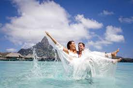 The clip is thought to have been filmed in beirut, lebanon, and shows the couple jumping into the water. Trash The Wedding Dress In Bora Bora Why And How To Do It