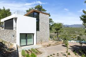 It should be mounted on a pole or tree about 4 feet off the ground. Butterfly Roof Wedge House By Schema Is Located In A Piny Area In Greece