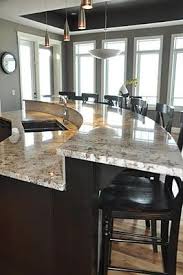 These kitchen islands designs are a wonderful way to increase the seating for larger meals, especially if you have children. Curved Kitchen Island Ideas With Sink