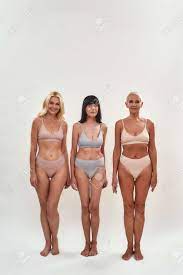 Women Over 50. Portrait Of Three Charming Mature Female Friends In  Underwear Posing Together Half Naked Isolated Over Light Background Stock  Photo, Picture and Royalty Free Image. Image 165986828.