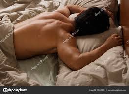 Back view of man sleeping in bed. Stock Photo by ©MicrostockAsia 133439522