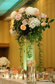 Check spelling or type a new query. Like How The Leaves Trickle Down The Vase And The Flowers Are Spaced Wedding Flower Table Decorations Wedding Table Flowers Colorful Wedding Centerpieces