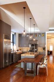The wooden legs of the kitchen island is painted in white, with gray open shelves and a solid wood counter top. Island With Attaching Breakfast Bar Kitchen Design Contemporary Kitchen Interior Design Kitchen