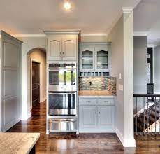 Built In Stainless Steel Double Oven Gray Painted Kitchen Cabinets Arched Doorway Http Www Bickimerhomes C Grey Painted Kitchen Home Built In Double Ovens