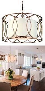 Dining room with warm lighting linen shade chandelier table lamp and recessed lights. How To Make A Statement With A Modern Chandelier Kitchen Table Lighting Lights Over Dining Table Drum Shade Chandelier