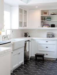 kitchen cabinets with dark floor tile