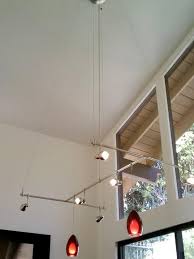 Designer S Notes A Sleek Custom Monorail Light System With Italian Blown Glass Pendants Brings Charact Monorail Lighting Dining Room Ceiling Floating Lights