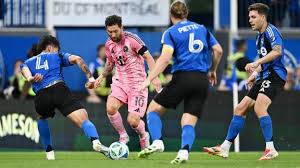 Lionel Messi scores during an MLS match, showcasing his soccer talent