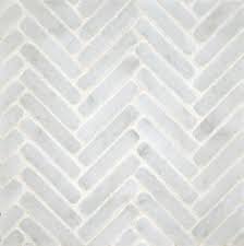 We raised the ceilings to 10 feet, added substantial mouldings and casing details, and restored the original wood floors. Ann Sacks Herringbone Mosaic Eclectic Tile Tiles House Tiles