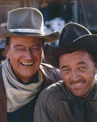 John Wayne with costar and friend Robert Mitchum