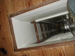 A repurposed door closes off the attic space in the home of our reader remodel contest winners for when the family wants to. Attic Completed