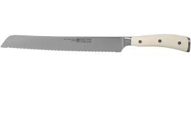 The serrated edge of the bread knife guides the blade through tough crust without compressing the soft inside and leaves minimal crumbs. Wusthof Classic Ikon White Double Serrated Bread Knife 23 Cm Advantageously Shopping At Knivesandtools Com