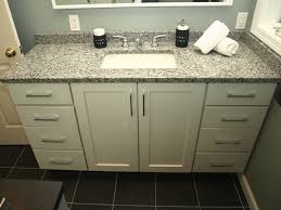 This beautiful natural stone vanity top is attached to a rectangular white vitreous china undermount bowl with a safety overflow hole. Semi Custom Vanity White Shaker Doors With Granite Top Contemporary Bathroom New York By Kraftmaster Renovations Houzz Au