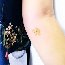 Subtle Yellow Flower By Luiza Oliveira Yellow Tattoo Small Tattoos Small Matching Tattoos