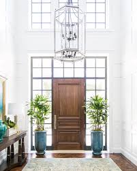 We Love Making An Entrance This Breathtaking Foyer Features Three Stories Of Custom Paneling A Three Foyer Decorating Living Room Styles Italian Living Room