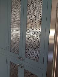 Attention To Detail In Using A Custom Mesh As A Center Panel Provides A Clean Look Fulfilling The Designer S Visi Kitchen Cabinet Doors Cabinet Doors Cabinetry