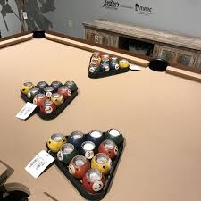 Pool table, cues, cabinet for the cues, balls and 2 tall chairs for spectators. Photos At Jordan S Furniture Furniture Home Store