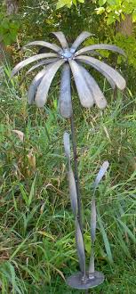Neutral, flamed metal garden art goes with just about every style of home. Metal Flowers Daisy Garden Art Steel Flowers Steel Daisy Metal Daisy Daisies Steel Daisies M Metal Garden Art Metal Tree Wall Art Metal Flowers