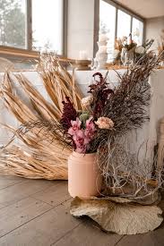 The aisle was lined with rose petals, lanterns, and flower. Natural Boho Beach Wedding Inspiration