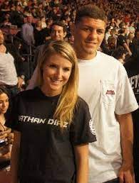 Nick looks like he stays in kill mode even when hes with his gf who has a phat ass. Fighter Nick Diaz With His Girlfriend Notice That Her Shirt Has His Brother S Name On It Awkwaaard Nick Diaz Girlfriend Nate Diaz Girlfriend Nate Diaz